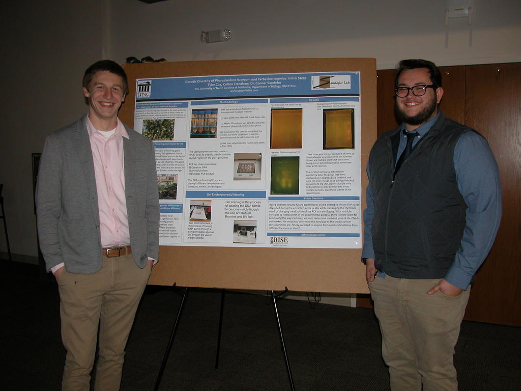Colton Crenshaw (left) and Tyler Cox present their research poster