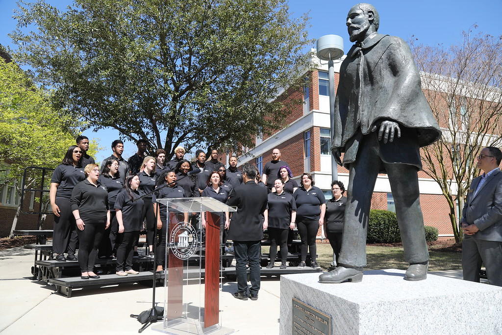 Pembroke Singers, led by Dr. Jose Rivera, perform at the Hamilton McMillan re-dedication ceremony on March 28, 2019