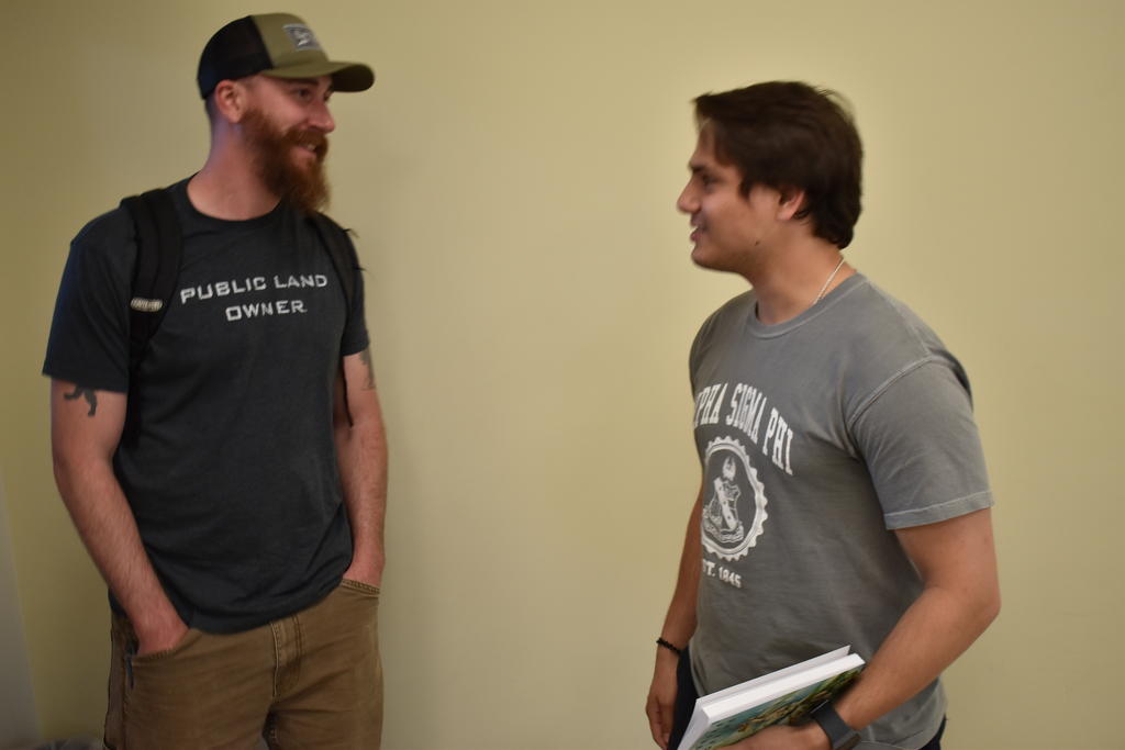 Author David Joy engages with a UNCP student during his visit