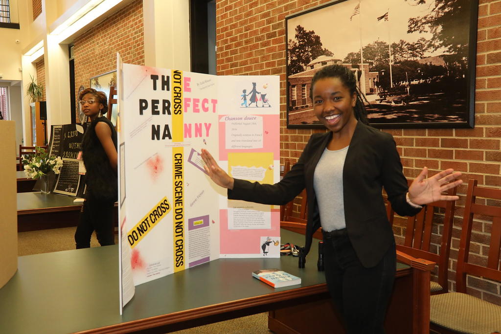 Jazmine Borden proudly displays her project at the World Literature Book Fair