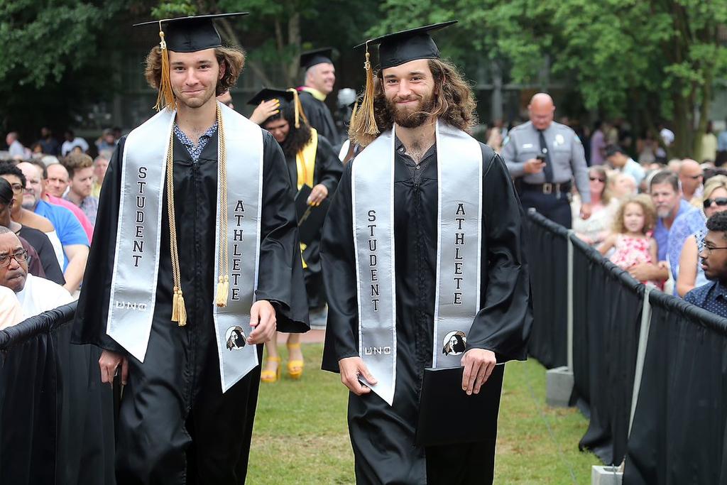 Twins Jonathan (left) and Matthew Martin, members of the Track & Field/Cross Country squads, were among the graduates at Spring Commencement