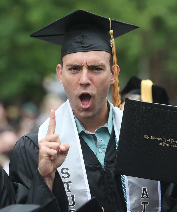 Ean Ormsby, a member of the Track & Field team, shows his excitement at Commencement