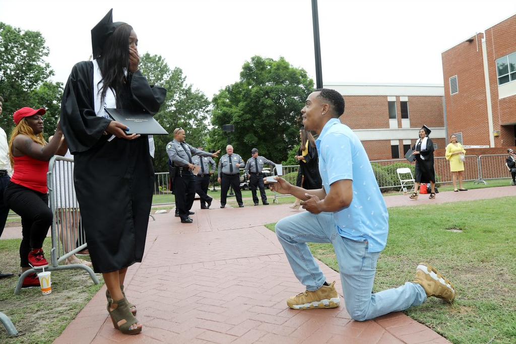 Vincent Molson proposes to his girlfriend, Diandra Ingram, after she crossed the stage Saturday. Molson is stationed at Ft. Bragg and will deploy to Afghanistan in June