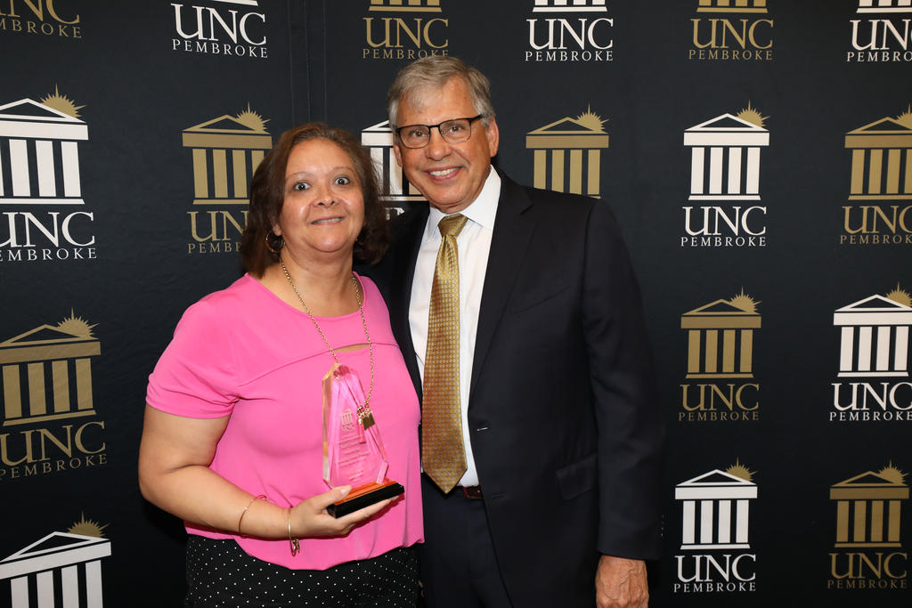 Chancellor Robin Gary Cummings presents Kim Hunt with the Changing Lives Through Education Award at the Staff Awards Ceremony on June 6, 2019