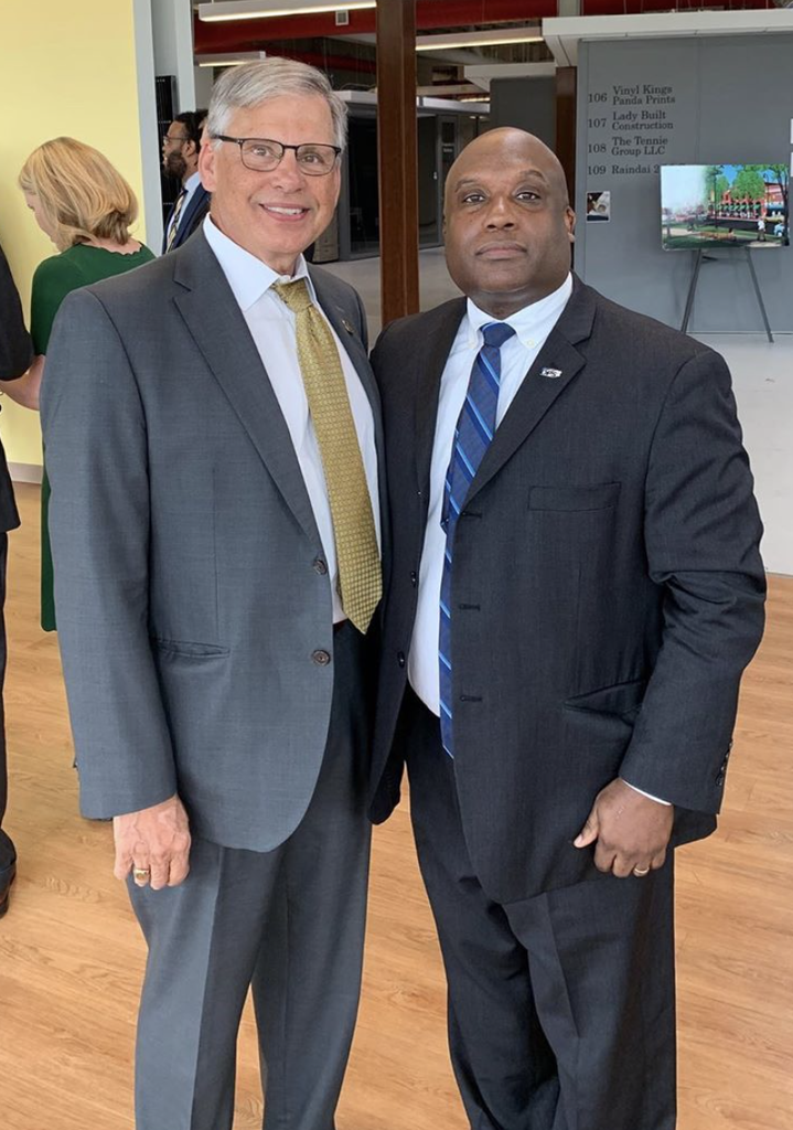NC Public Safety Secretary Erik Hooks, right, met with Chancellor Robin Gary Cummings on July 24 after presenting the university with a grant to purchase public safety equipment