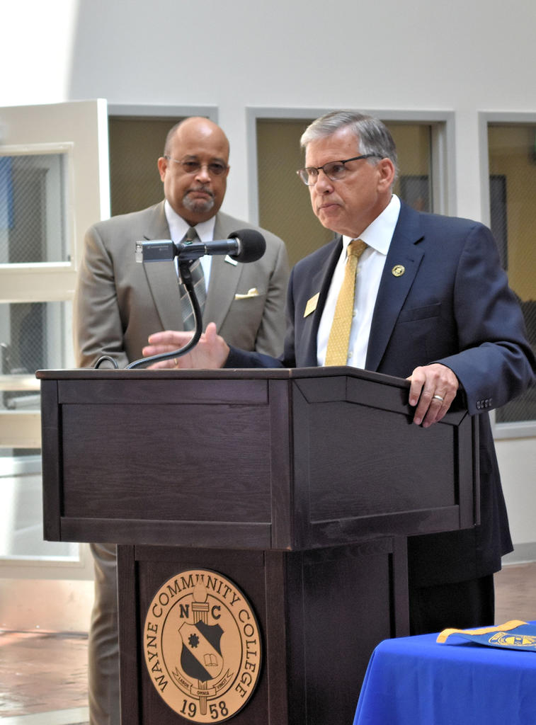 Chancellor Robin Gary Cummings speaks during a BraveStep agreement ceremony at Wayne Community College as WCC President Thomas Walker looks on