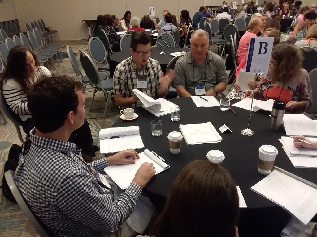 Lecturer Aaron Cole (center left) presented his paper, “Preparing Students for Discipline: Specific Writing through Explicit Genre Comparison,” for a round table discussion at the Lilly Conference on Innovative Strategies to Advance Learning” in Asheville, NC.