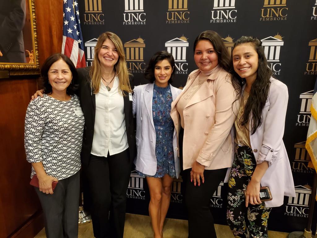 OLÉ and Acto Latino advisors Ms. Milagros López and Dr. Cecilia Lara (left), along with Acto Latino students Wendys and Joselyn (right), pose with UNCP Distinguished Speaker Diane Guerrero (center). (Photo courtesy of Milagros Lopez-Fred)