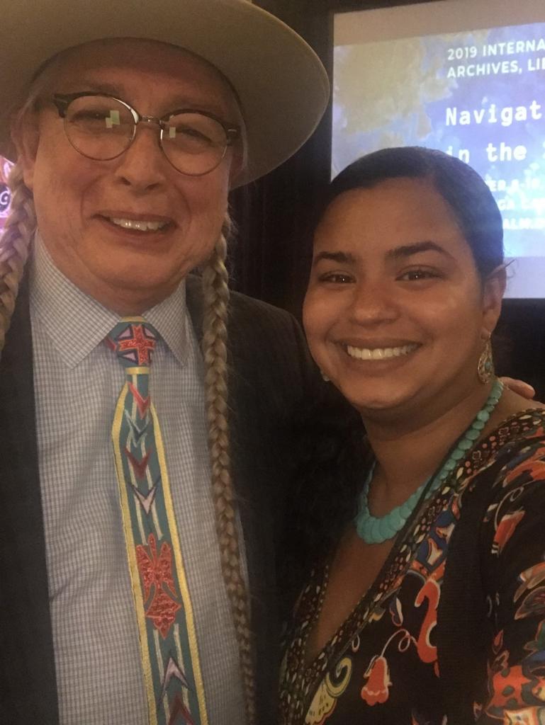 Hannah poses with Walter Echo-Hawk, chairman of the Association of Tribal Archives, Libraries, and Museums. Echo-Hawk spoke at UNCP in 2014 as part of the Native American Speaker Series