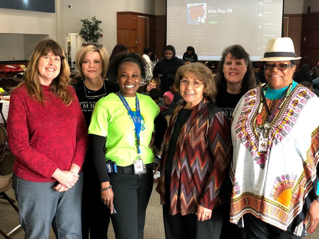 Professors Deana Johnson (second from right) and Amy Williams (second from left) held a reading party at R.B. Dean Elementary School in Maxton, NC.