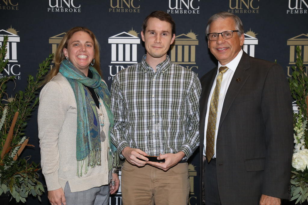 Michael Estler was named MPA Student of the Year. He is pictured with Dr. Emily Neff-Sharum and Chancellor Cummings