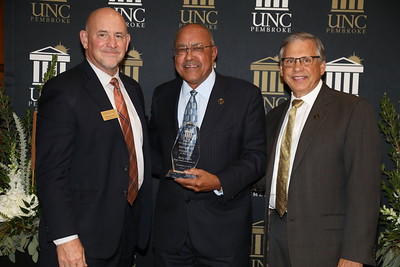 Ricky Harris was named Entrepreneur of the Year. He is shown with Thomas Hall and Chancellor Cummings