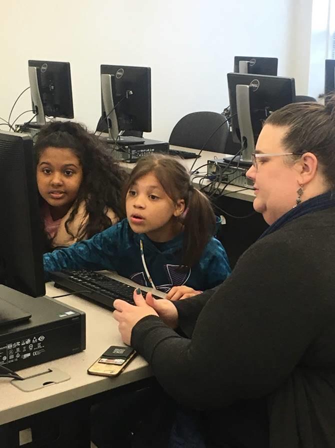 Dr. Lisa Mitchell, interim Associate Dean for the School of Education with members of the Girls Who Code program.