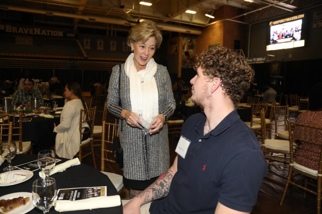 Linda Metzger chats with Spencer Levi, one of hundreds of scholarship awardees in attendance at the annual Scholarship Recognition Dinner