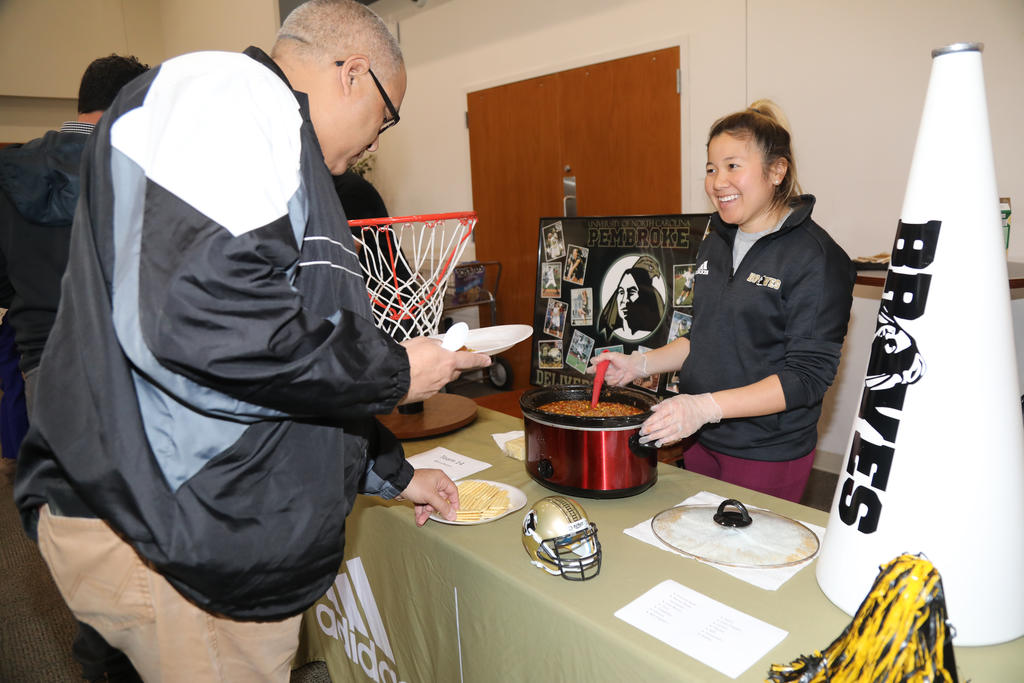 Craymon Strickland Jr. samples on the many entries at the Staff & Faculty Chili Cook-Off