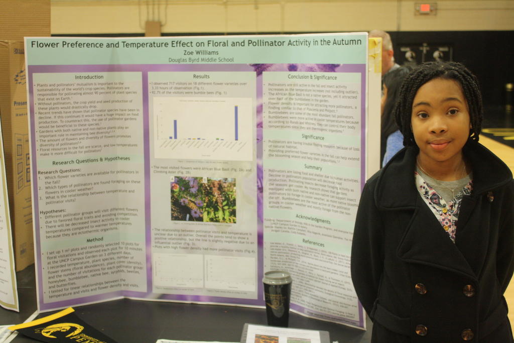 Zoe presents research poster about flower visitation
