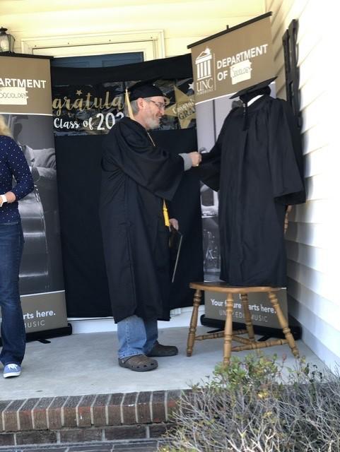 UNCP grad Eugene Kaplan was given a special graduation at the home of his daughter Meggan Hollis on May 9
