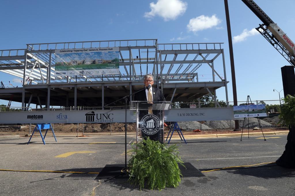 Chancellor Robin Gary Cummings speaks during a topping out ceremony for the James A. Thomas Hall