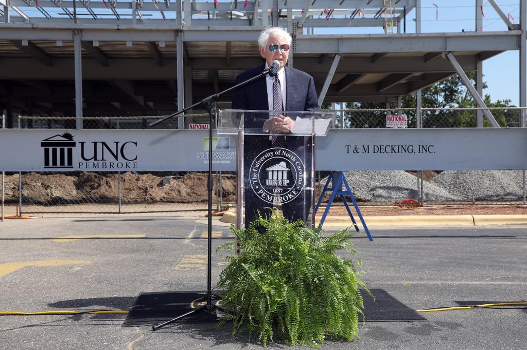 Jim Thomas speaks at the topping out ceremony for the James A. Thomas Hall on July 23, 2020
