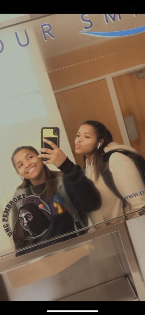 Kyria Locklear (left) snaps selfies with her twin Kelsey Locklear