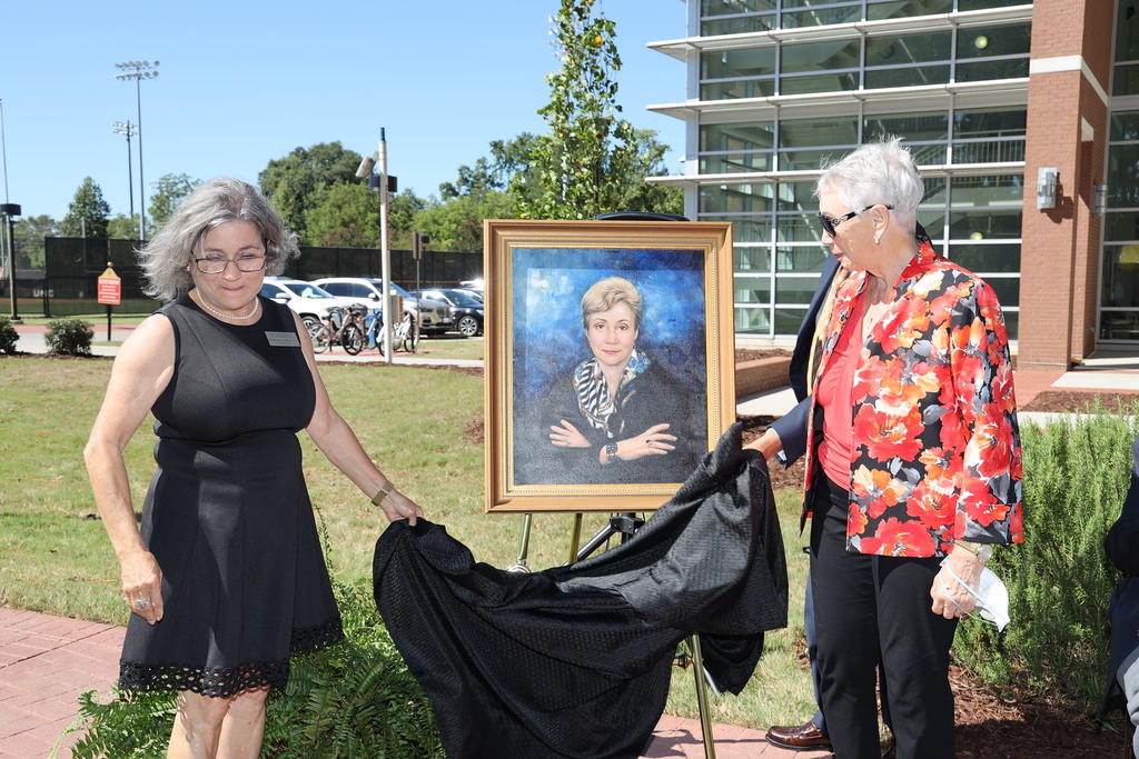 Dr. Cherry Beasley and Chancellor Robin Gary Cummings unveils a portrait of former UNCP Trustee Mary Ann Elliott which will hang in the McKenzie-Elliott School of Nursing