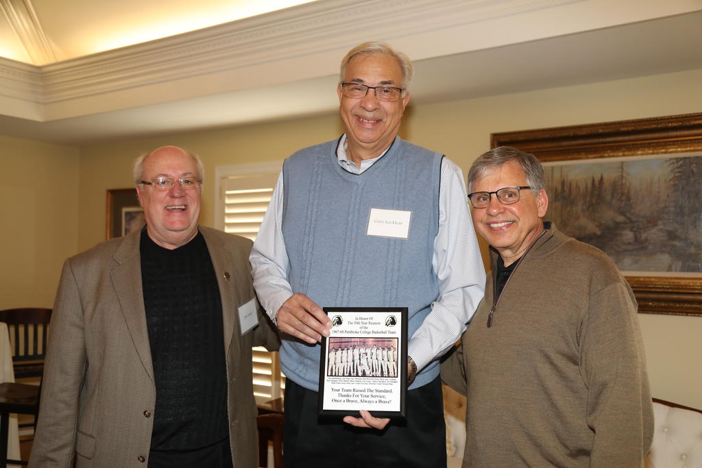 Gary Wayne Locklear, center, shown during a Men's basketball team reunion, with Jim Gane and Chancellor Cummings