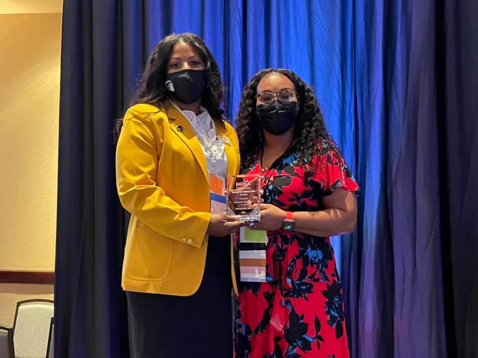 Dr. Meka Douthit, NCNA President-Elect, (right) presents Jermecka Covington with the North Carolina Nurses Association (NCNA) Rookie of The Year Award