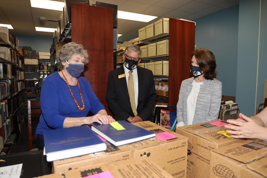 Vivian R. Jacobson chats with Chancellor Robin Gary Cummings and Carla Rokes about a book containing the original sketches and development process for L’Échelle de Jacob.