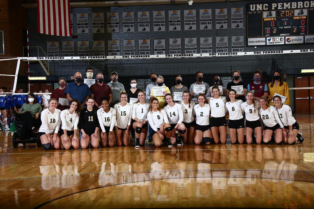 Volleyball team and their honored faculty and staff