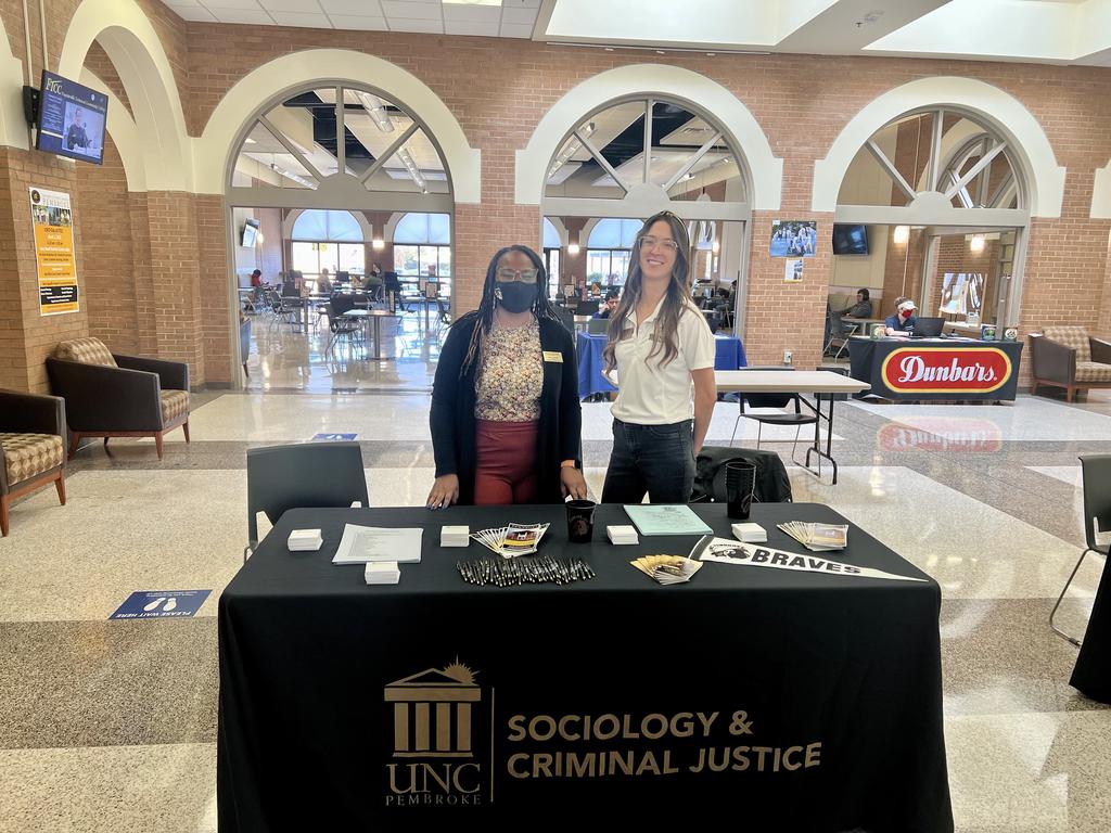 Mecca Terry and Corey Pomykacz represent the sociology and criminal justice department for UNCP Day at Fayetteville Technical Community College.