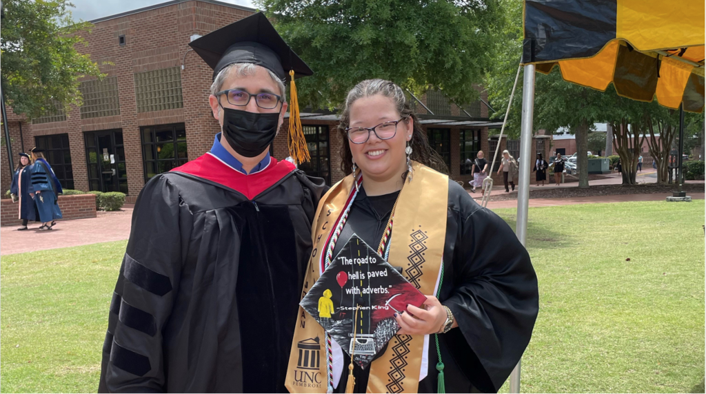 Dr. Peter Grimes (left) poses for a photo with Spring 2022 ETWL graduate Lakota Craft.