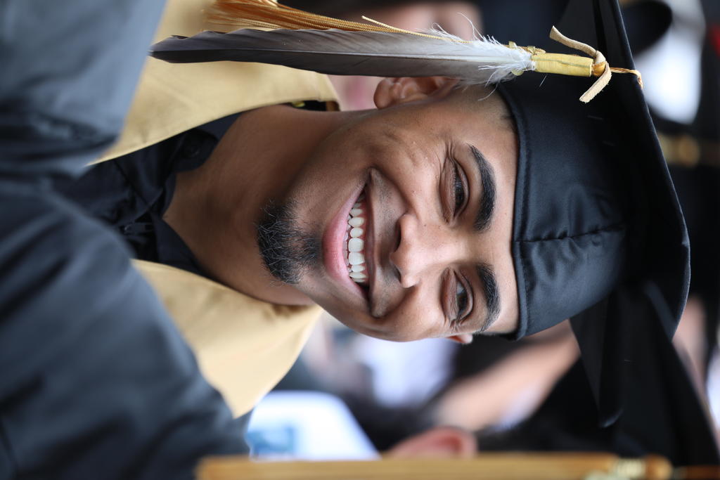Jolan Locklear is all smiles as he awaits to hear his name called at Spring Commencement on May 14, 2022