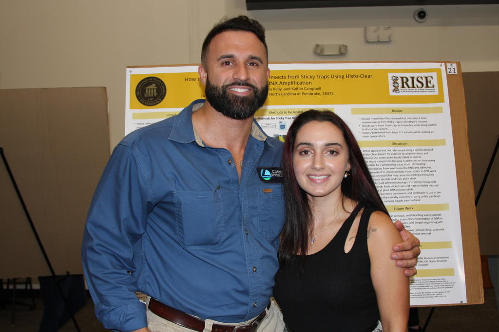 Kinsley Adams (right) and her brother during a "break" in the poster presentations