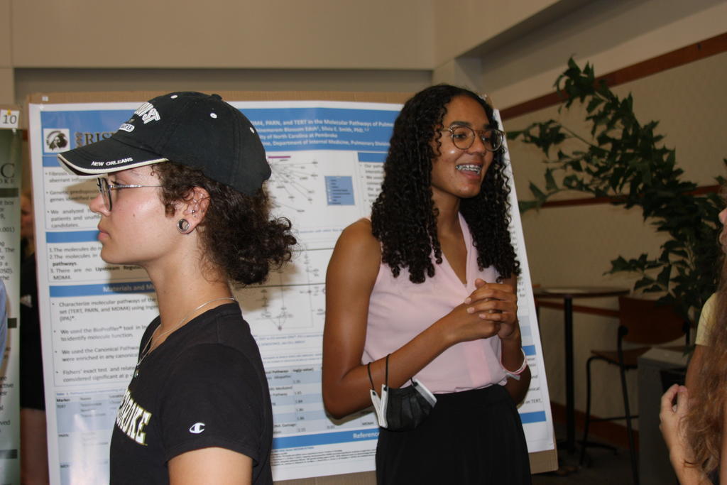 Students learn about scientific research during poster presentations