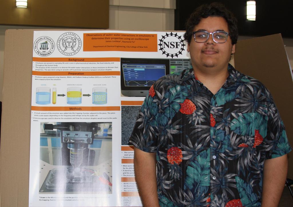 James Locklear presents his research poster