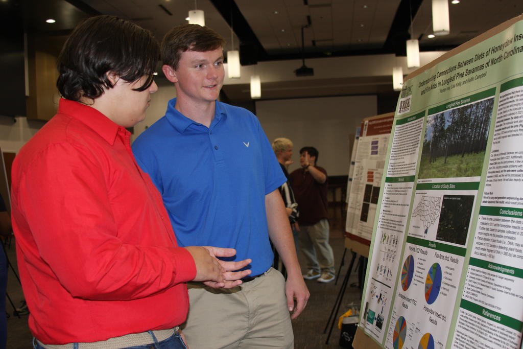 Hunter Ivey (left) and Tony Gathings in front of Hunter's research poster