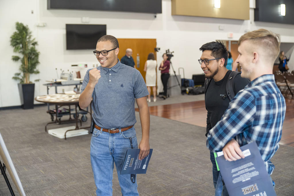 Caleb Locklear (left) and McLean Pait III (far right) at the End-of-Summer RISE Symposium