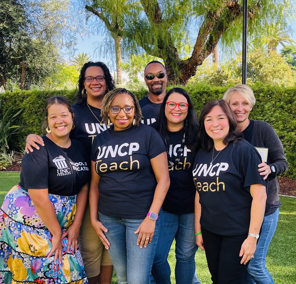 School of Education Dean Loury Floyd is flanked by members of UNCP Branch Ed project members Drs. Marisa Scott, Dr. Leslie Locklear, Dr. Tiffany Locklear, Dr. Mabel Rivera, Cynthia Lewis, Dr. Michael Riles