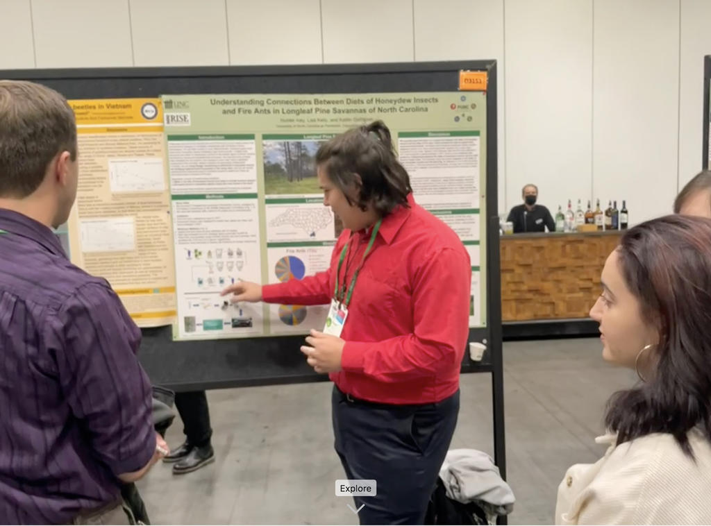 Hunter Ivey explaining a protocol in his poster, which won 2nd place in the Biodiversity competition