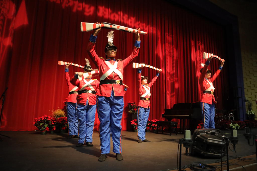 The colorguard performs "Parade of the Wooden Soldiers" at the 2022 Holiday Extravaganza