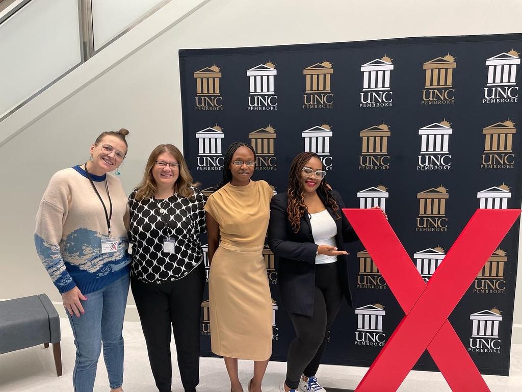 SOCJ Faculty (Standing left to right) Drs. Renee Lamphere, Tracy Vargas, Calvina Ellerbe, and Ms. Mecca Terry.  Dr. Ellerbe and Ms. Terry were speakers at the UNCP student-organized Tedx event that took place on February 11, 2023.