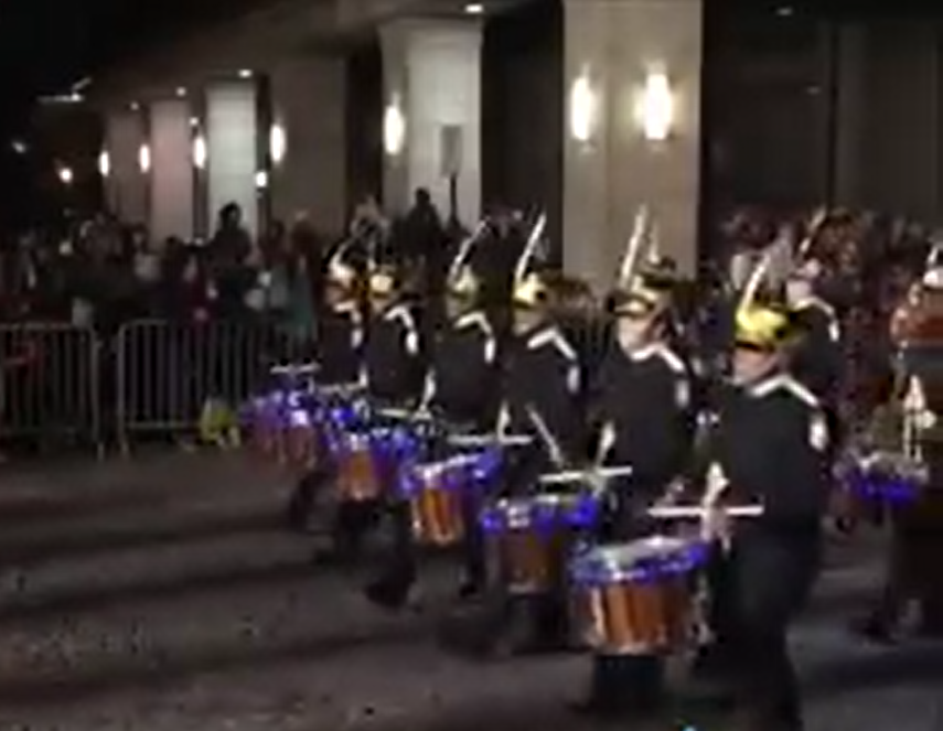 The drumline marches in the Grand Illumination Parade