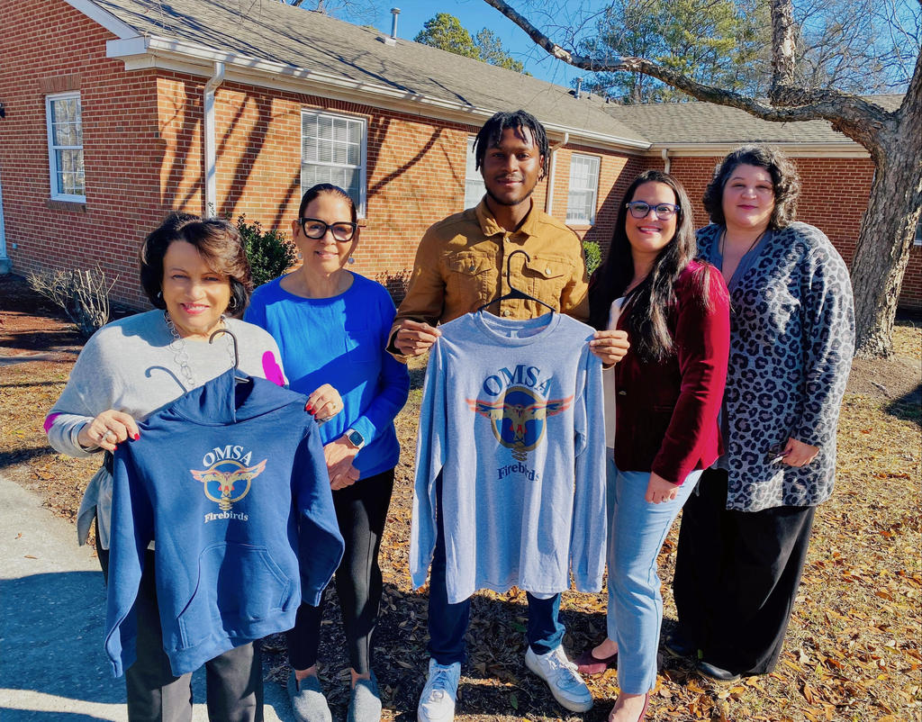 Preston Coker, middle, is pictured with OMSA board members Drs. Rose Marie Lowry-Townsend (left) Brenda Dial Deese, Tiffany Locklear and Denise Hunt.