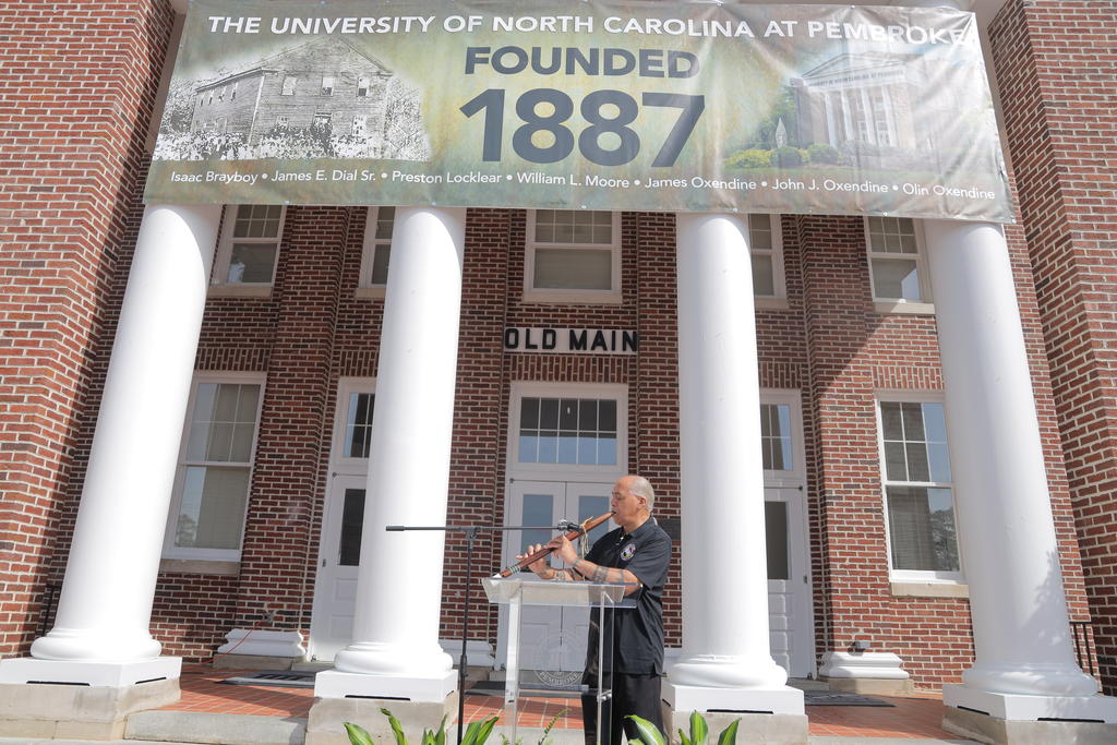 Lumbee traditional flutist Reggie Brewer performs an honor song at Founders' Day at UNCP on March 1, 2023