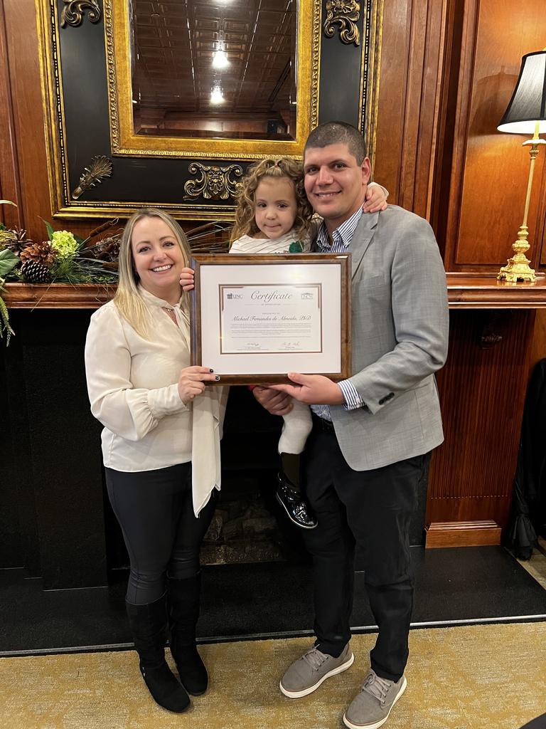 Dr. Michael Almeida with his wife Dr. Karen Farizatto and their daughter Sophia