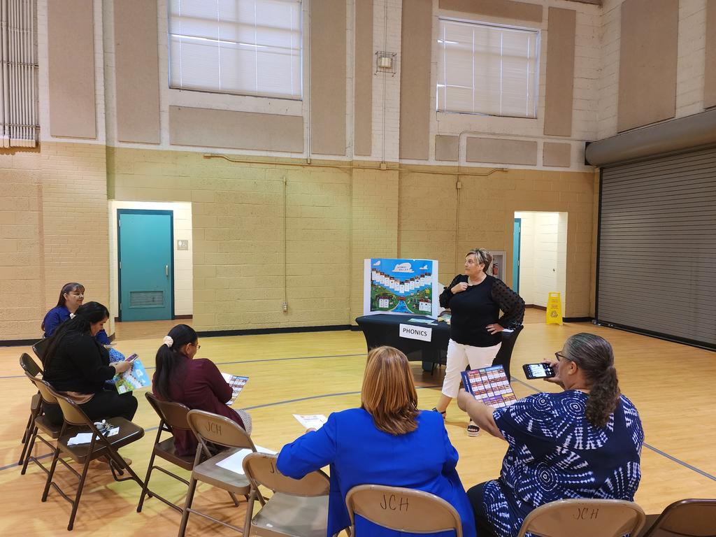 Georganna Gore gives a presentation during a Parent Reading Workshop at the Indian Education Resource Center gymnasium