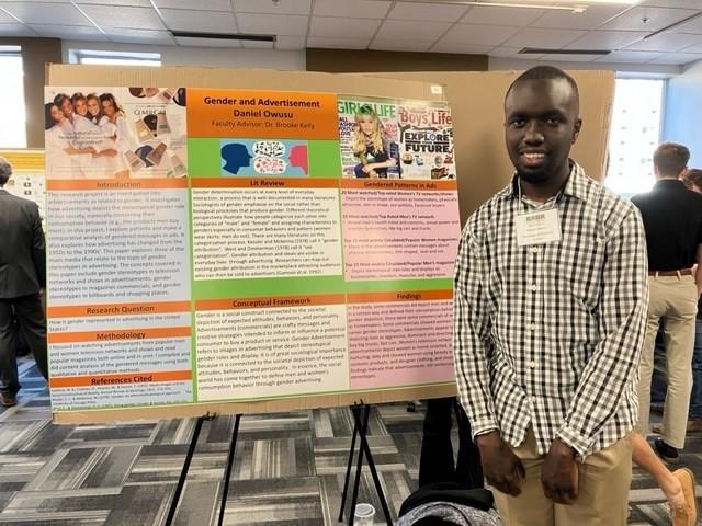 Daniel Owusu, a student in Dr. Brooke Kelly's Gender and Society course,  presents a content analysis of gender in advertisements for PURC.