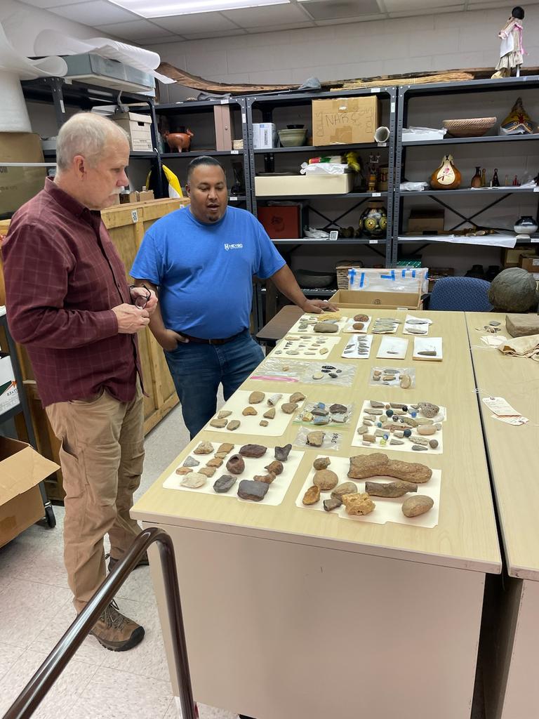 Harlen Chavis (right) discusses his findings with State Archaeologist John Mintz