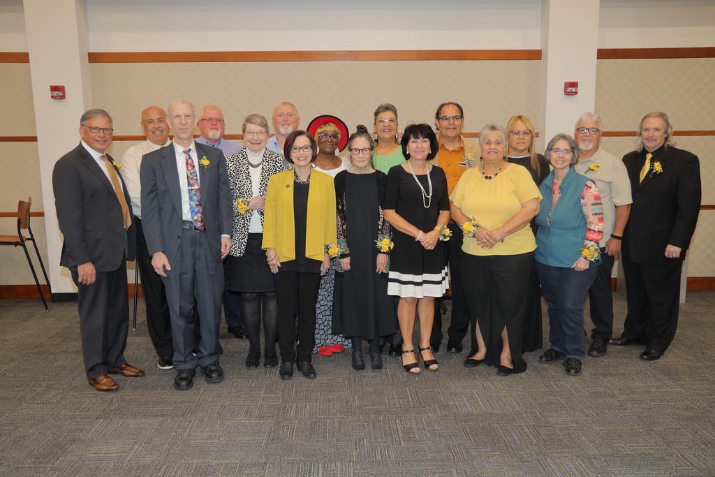 Chancellor Robin Gary Cummings pictured with retirees during a special celebration dinner at the UC Annex on April 11, 2023