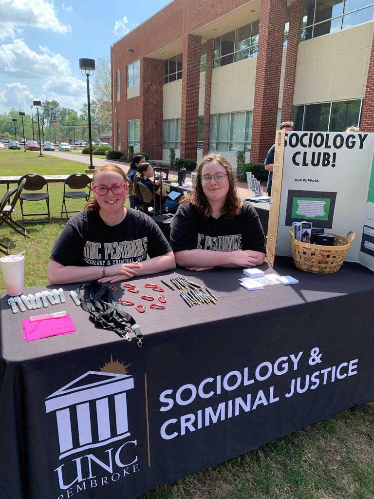Sociology club members working the Sociology & Criminal Justice department table at the STEM Fair on April 5, 2023.